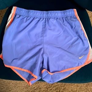 Nike athletic shorts; kids large; color is violet; used